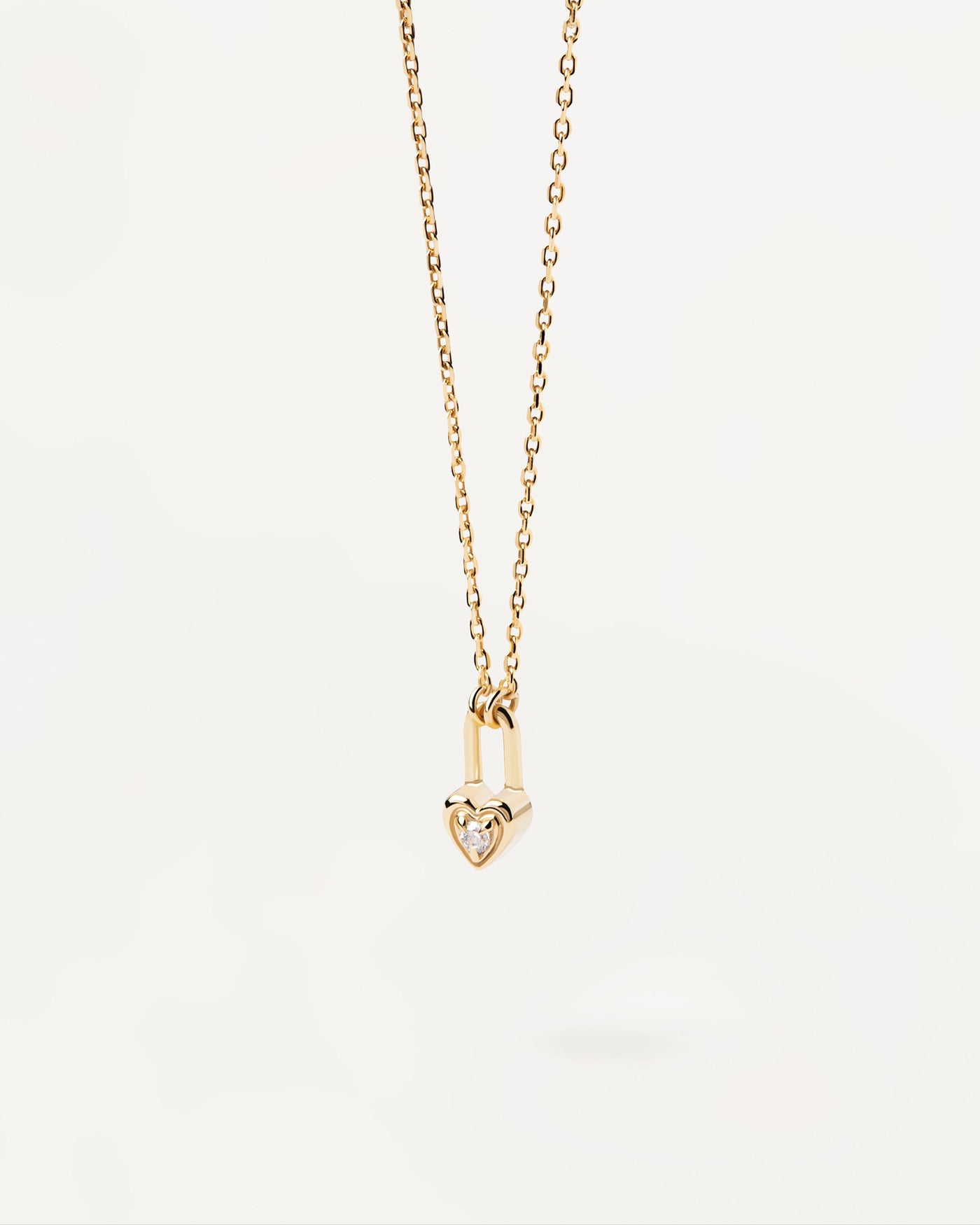 2023 Selection | Heart Padlock Necklace. Gold-plated necklace with heart padlock pendant set with white zirconia. Get the latest arrival from PDPAOLA. Place your order safely and get this Best Seller. Free Shipping.