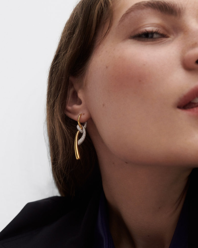 Elegant asymmetric hoop earrings with contrasting pavé zirconia knotted pendants