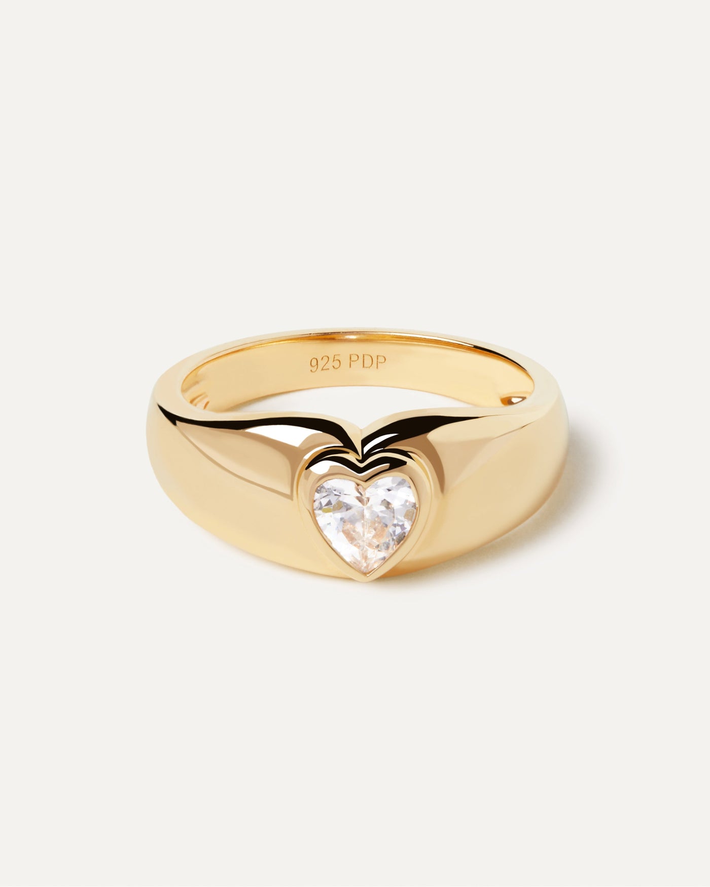 2023 Selection | Bright Heart Ring. Bold ring in gold-plated silver with heart-shaped zirconia. Get the latest arrival from PDPAOLA. Place your order safely and get this Best Seller. Free Shipping.