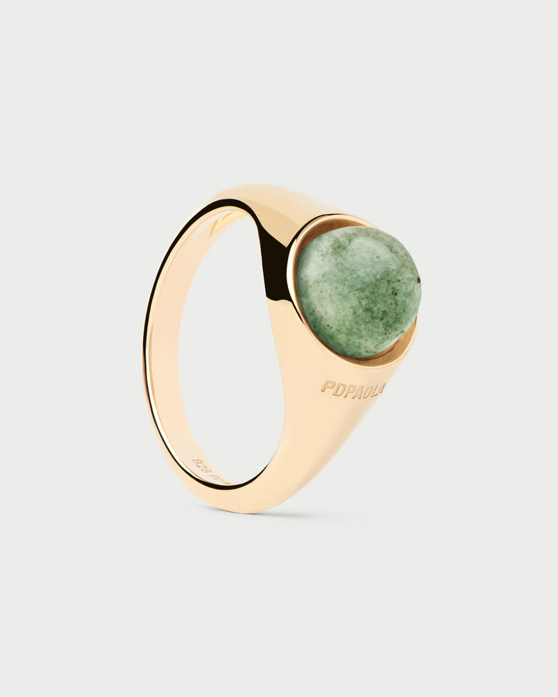 Gold-plated half sphere ring topped with an oval green gemstone