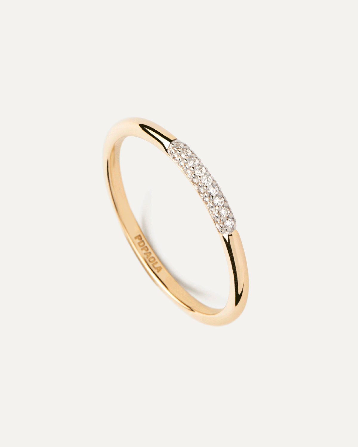 Diamonds and gold Nora ring. Dainty ring in solid yellow gold set with a row of pavé lab-grown diamonds at the top. Get the latest arrival from PDPAOLA. Place your order safely and get this Best Seller.