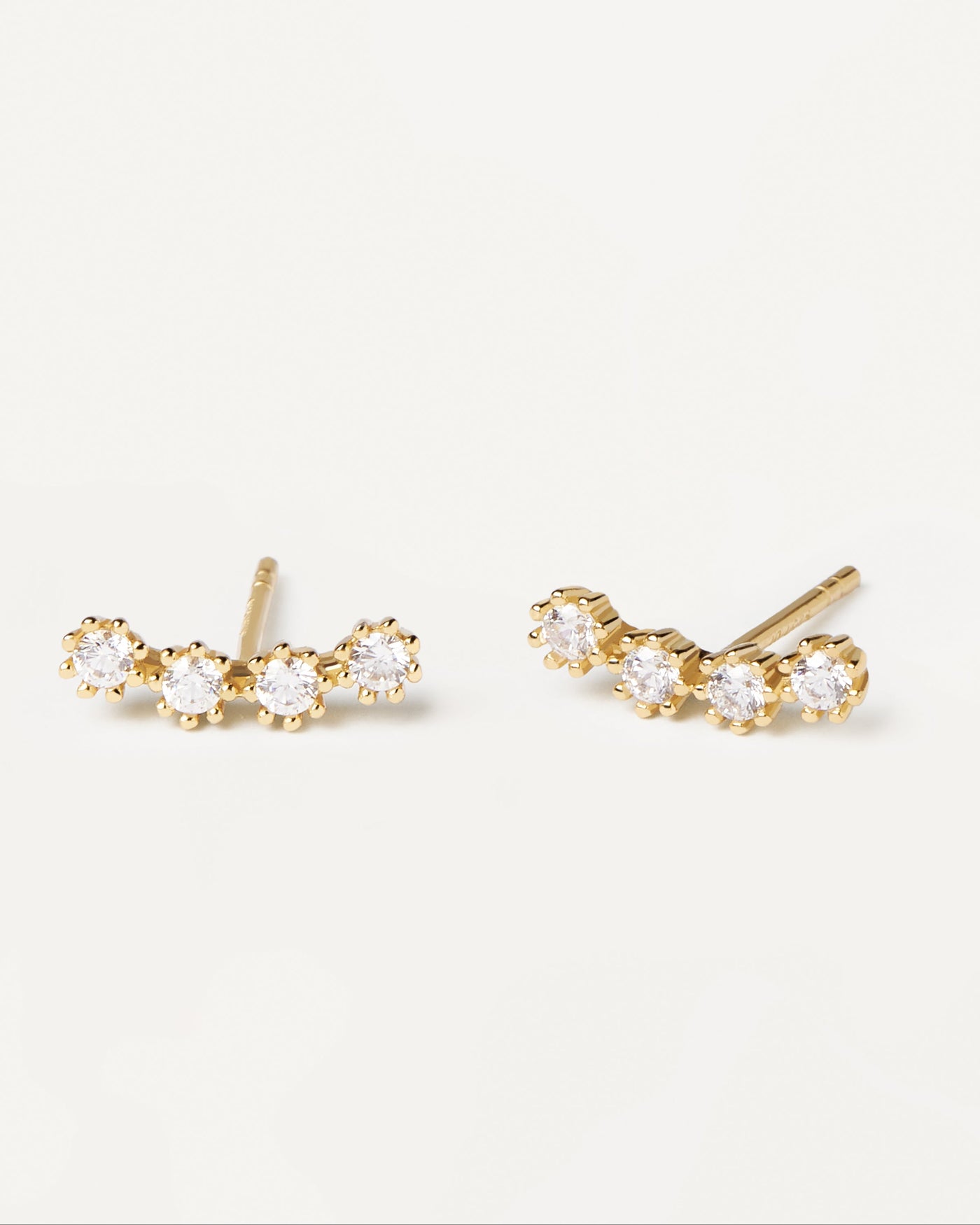 2023 Selection | White Tide Earrings. Climbing gold-plated stud earrings with four white zirconia in wavy shape. Get the latest arrival from PDPAOLA. Place your order safely and get this Best Seller. Free Shipping.