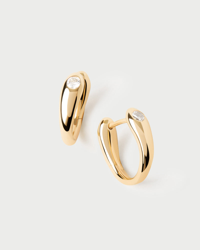 Modern hoop earrings topped with a round zirconia