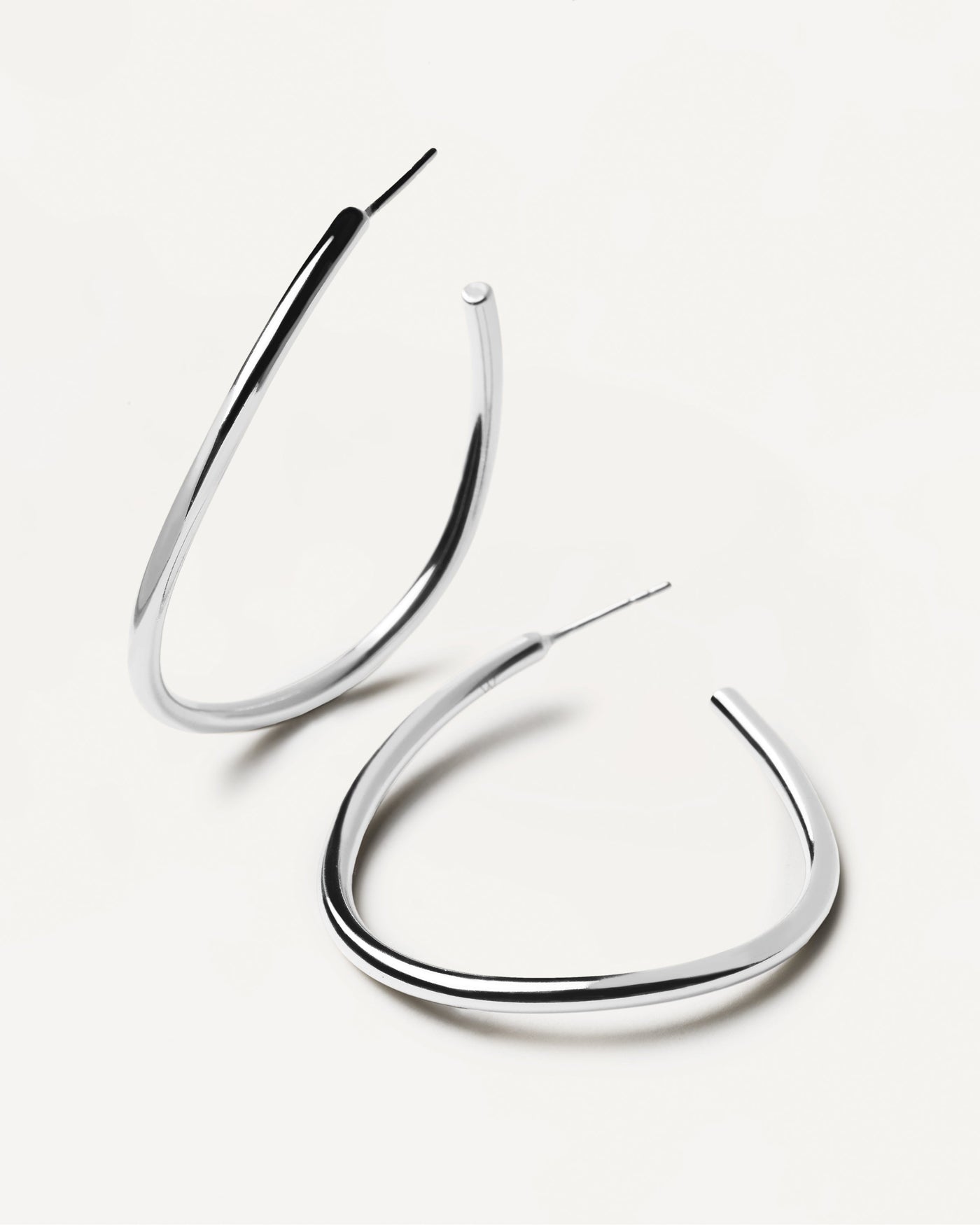 2023 Selection | Yoko Silver Earrings. Open loop large wavy hoop earrings in 925 sterling silver . Get the latest arrival from PDPAOLA. Place your order safely and get this Best Seller. Free Shipping.
