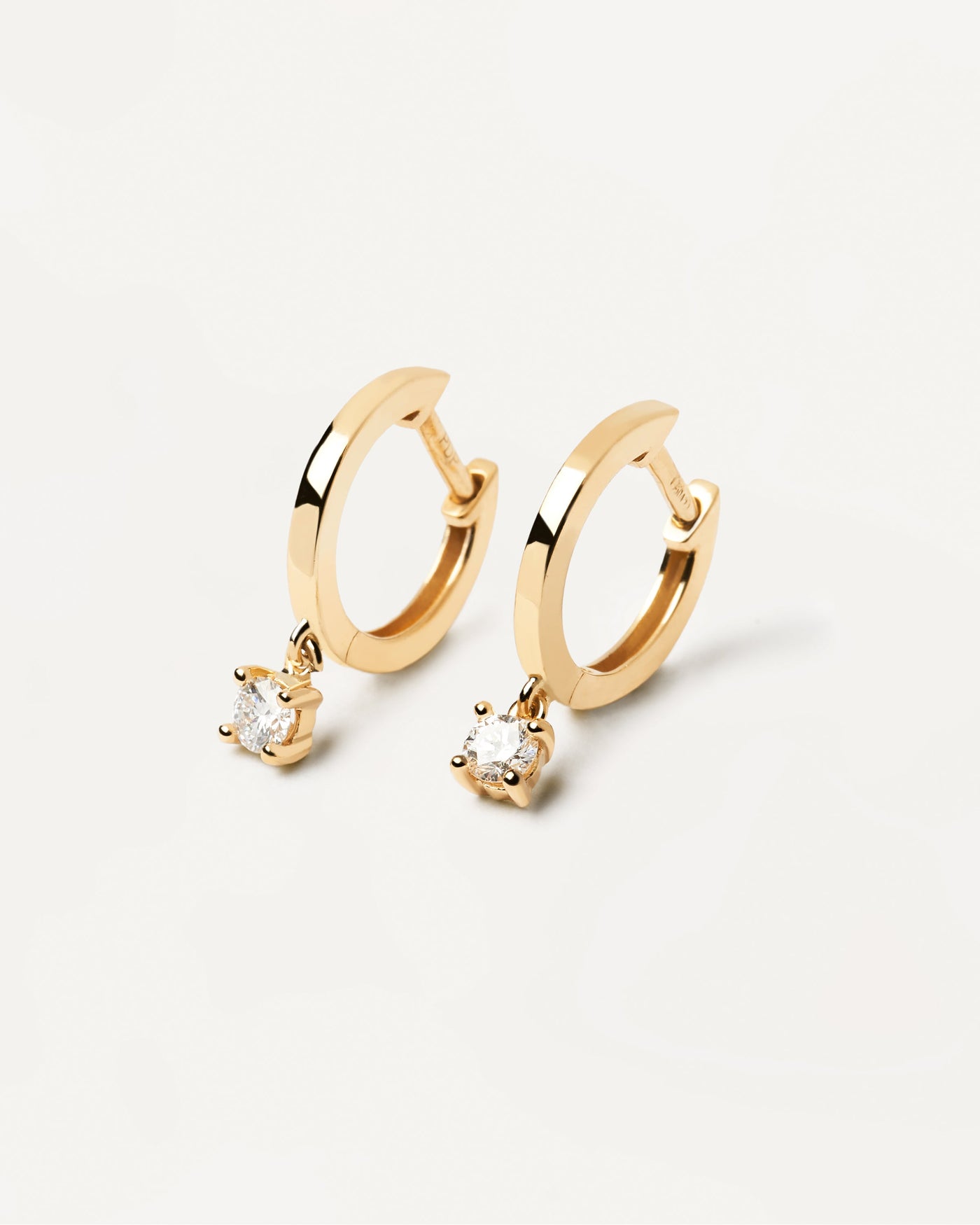 2023 Selection | Diamonds and Gold Drop Hoops. Hoop earrings in solid yellow gold with hanging lab-grown diamond of 0.10 carats each. Get the latest arrival from PDPAOLA. Place your order safely and get this Best Seller. Free Shipping.