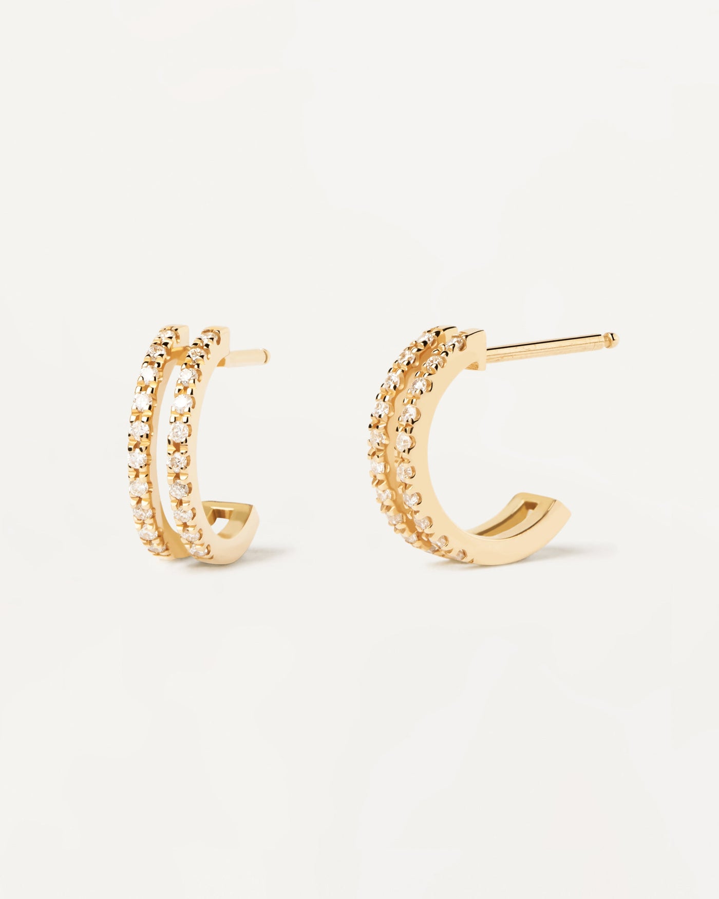 2023 Selection | Diamonds And Gold Dual Hoops. 18K yellow gold eternity earrings with 2 half hoops of lab-grown diamonds of 0.20 carat. Get the latest arrival from PDPAOLA. Place your order safely and get this Best Seller. Free Shipping.