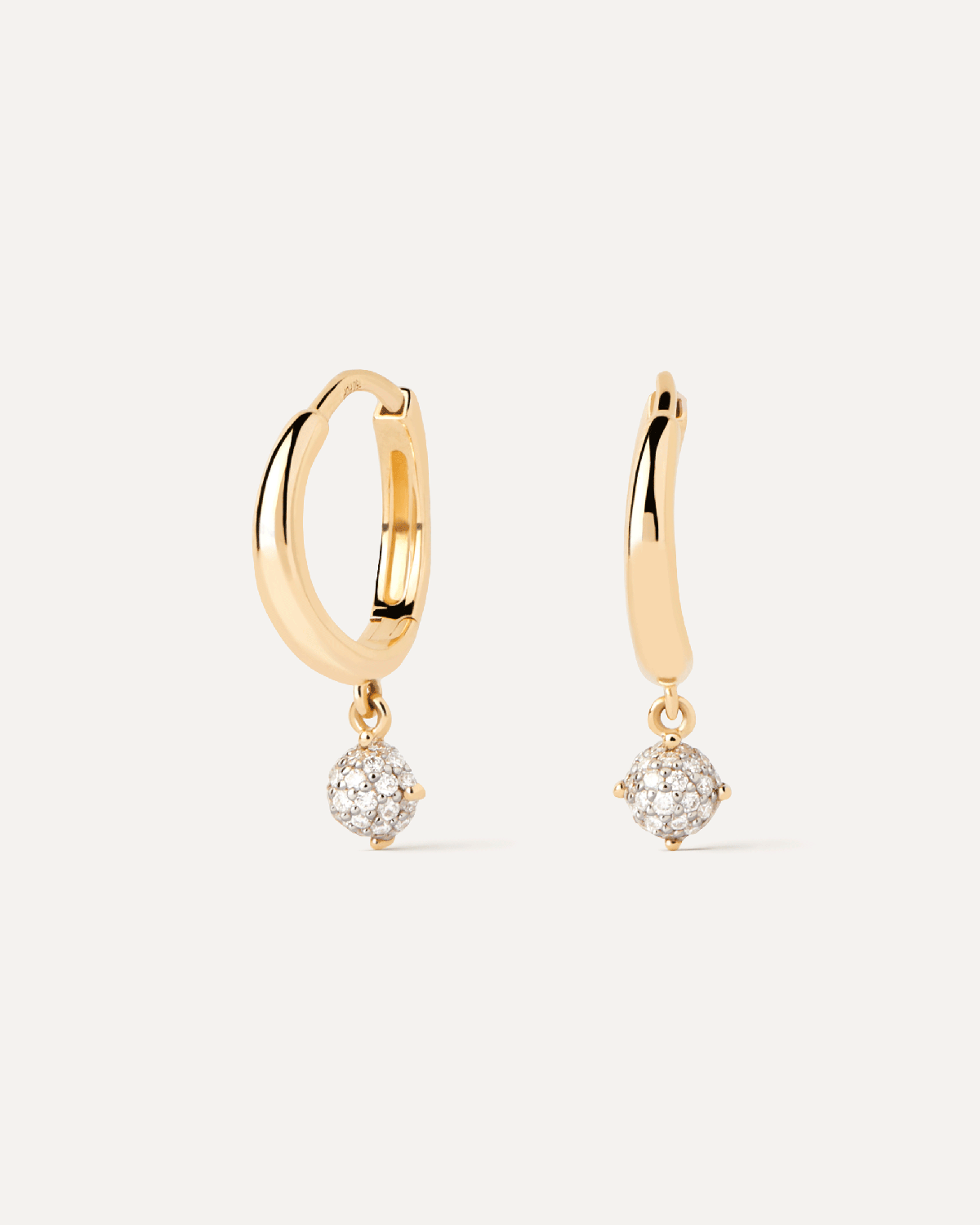 Diamonds and gold Dona hoops. Hoop earrings in solid yellow gold with a small round pavé lab-grown diamond pendant. Get the latest arrival from PDPAOLA. Place your order safely and get this Best Seller.