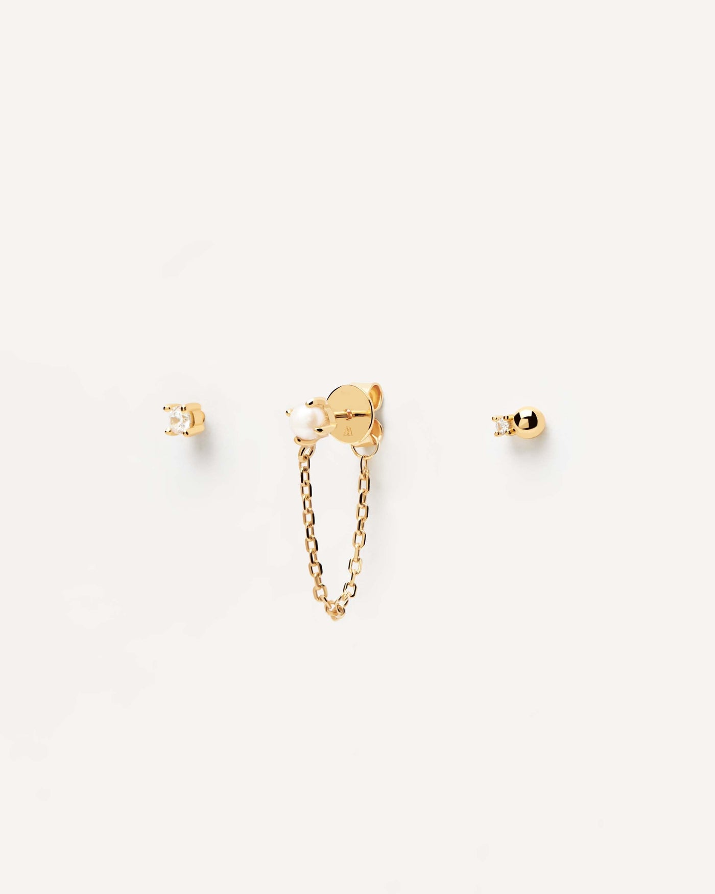 2023 Selection | Charlie Earrings Set. Set of three single earrings in 18k gold plated silver; a pearl stud with a chain and two zirconia. Get the latest arrival from PDPAOLA. Place your order safely and get this Best Seller. Free Shipping.