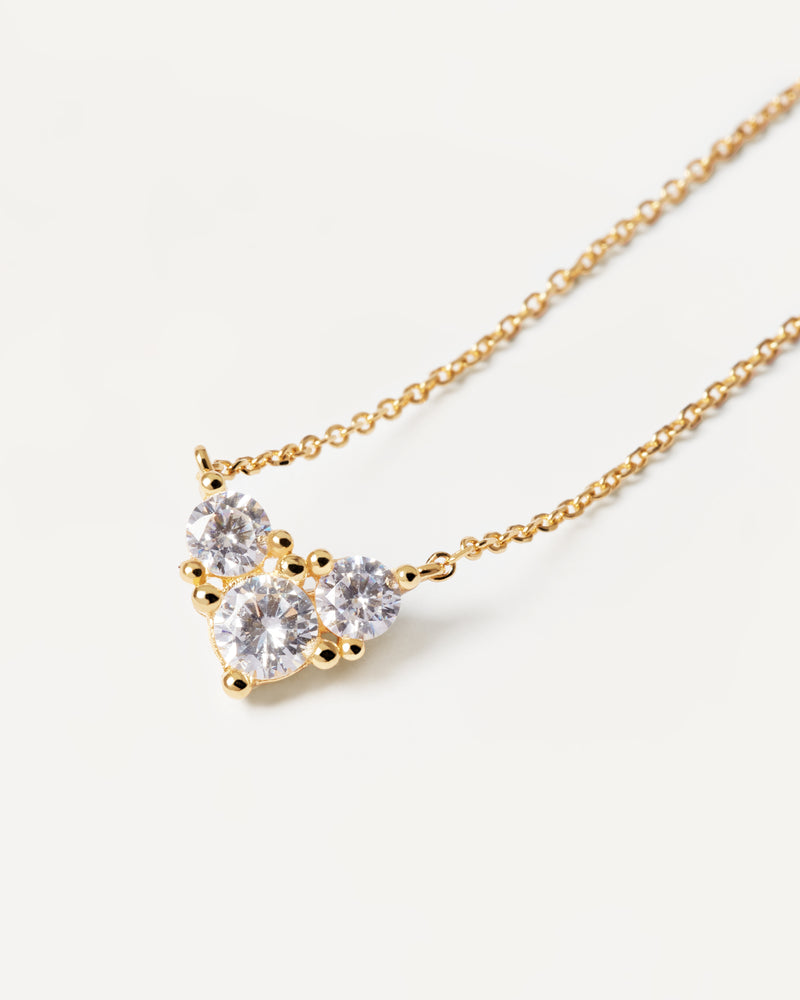 Gold-plated dainty heart shape necklace set with three white zirconia