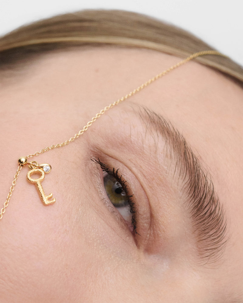 Key charm with sandblast texture and white zirconia to personalize necklace or bracelet
