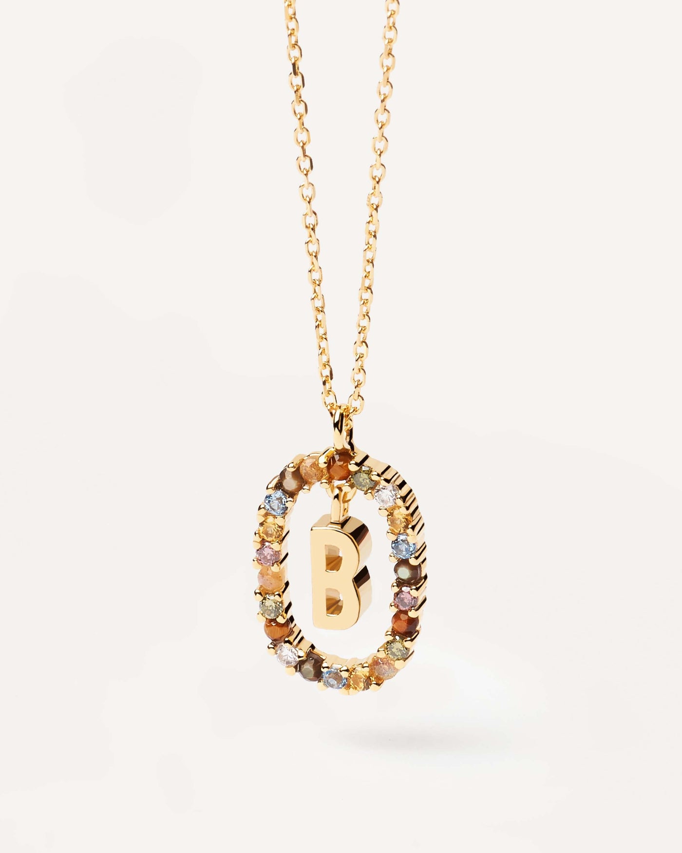 2023 Selection | Letter B necklace. Initial B necklace in gold-plated silver, circled by colorful gemstones. Get the latest arrival from PDPAOLA. Place your order safely and get this Best Seller. Free Shipping.