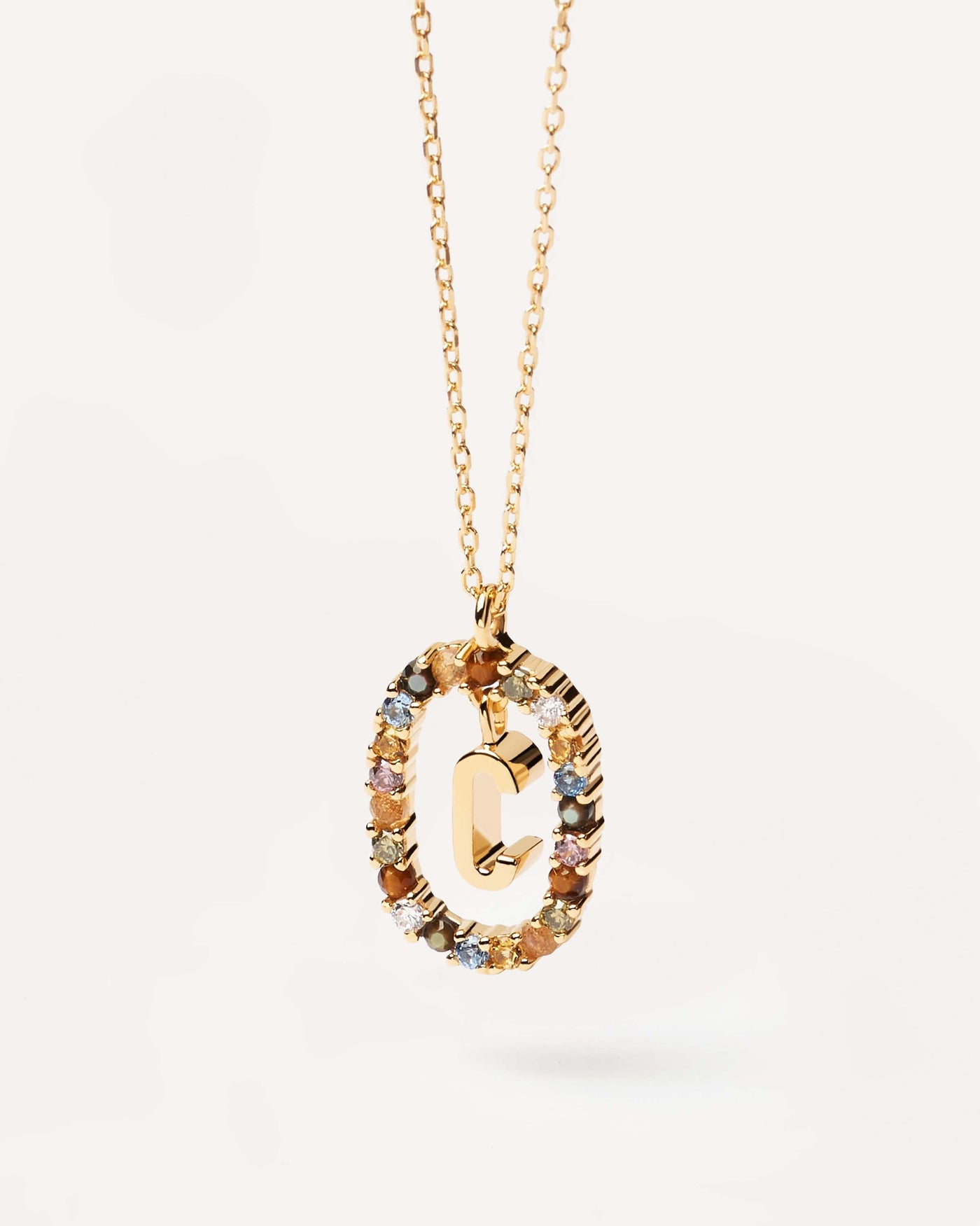 2023 Selection | Letter C necklace. Initial C necklace in gold-plated silver, circled by colorful gemstones. Get the latest arrival from PDPAOLA. Place your order safely and get this Best Seller. Free Shipping.