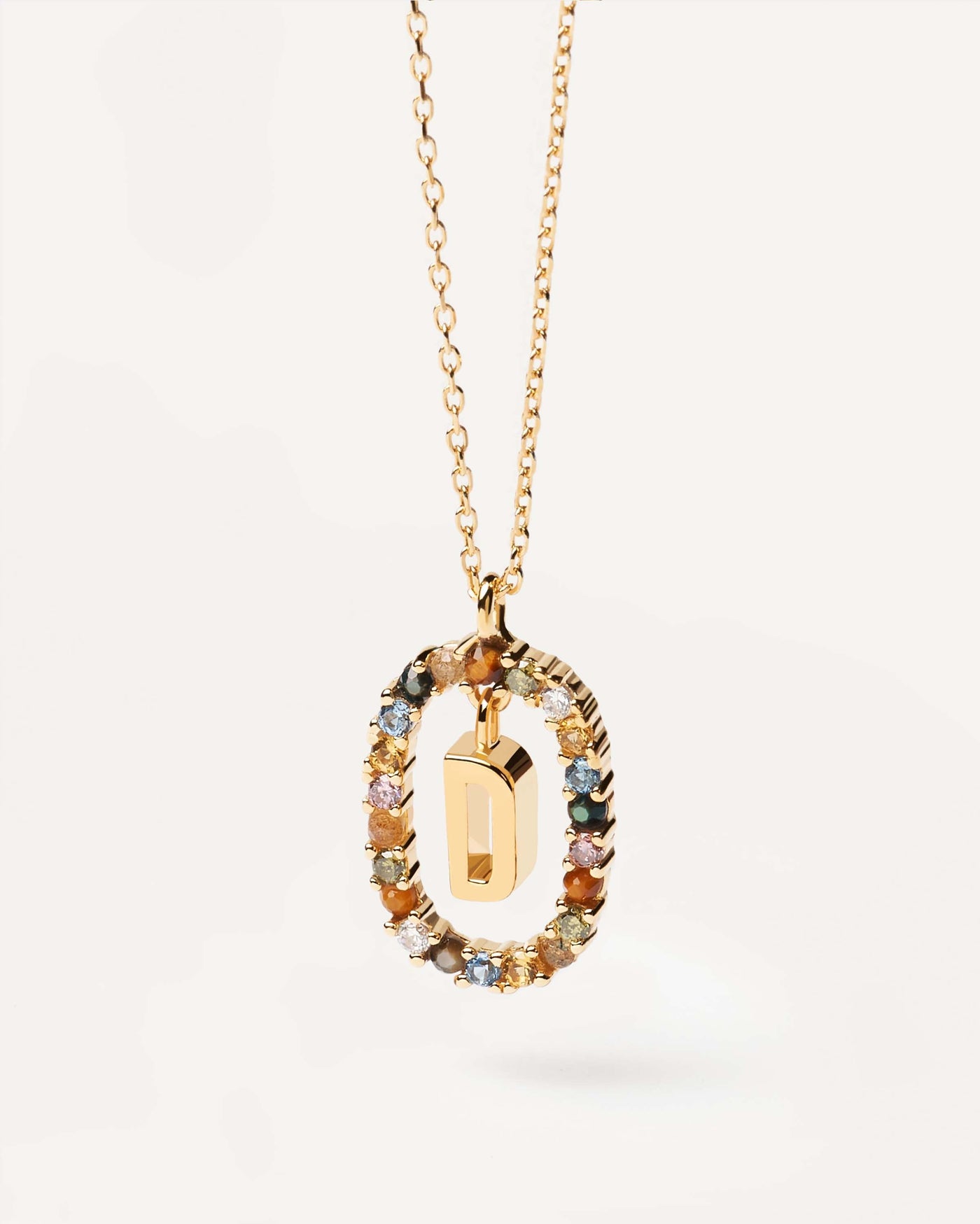 2023 Selection | Letter D necklace. Initial D necklace in gold-plated silver, circled by colorful gemstones. Get the latest arrival from PDPAOLA. Place your order safely and get this Best Seller. Free Shipping.