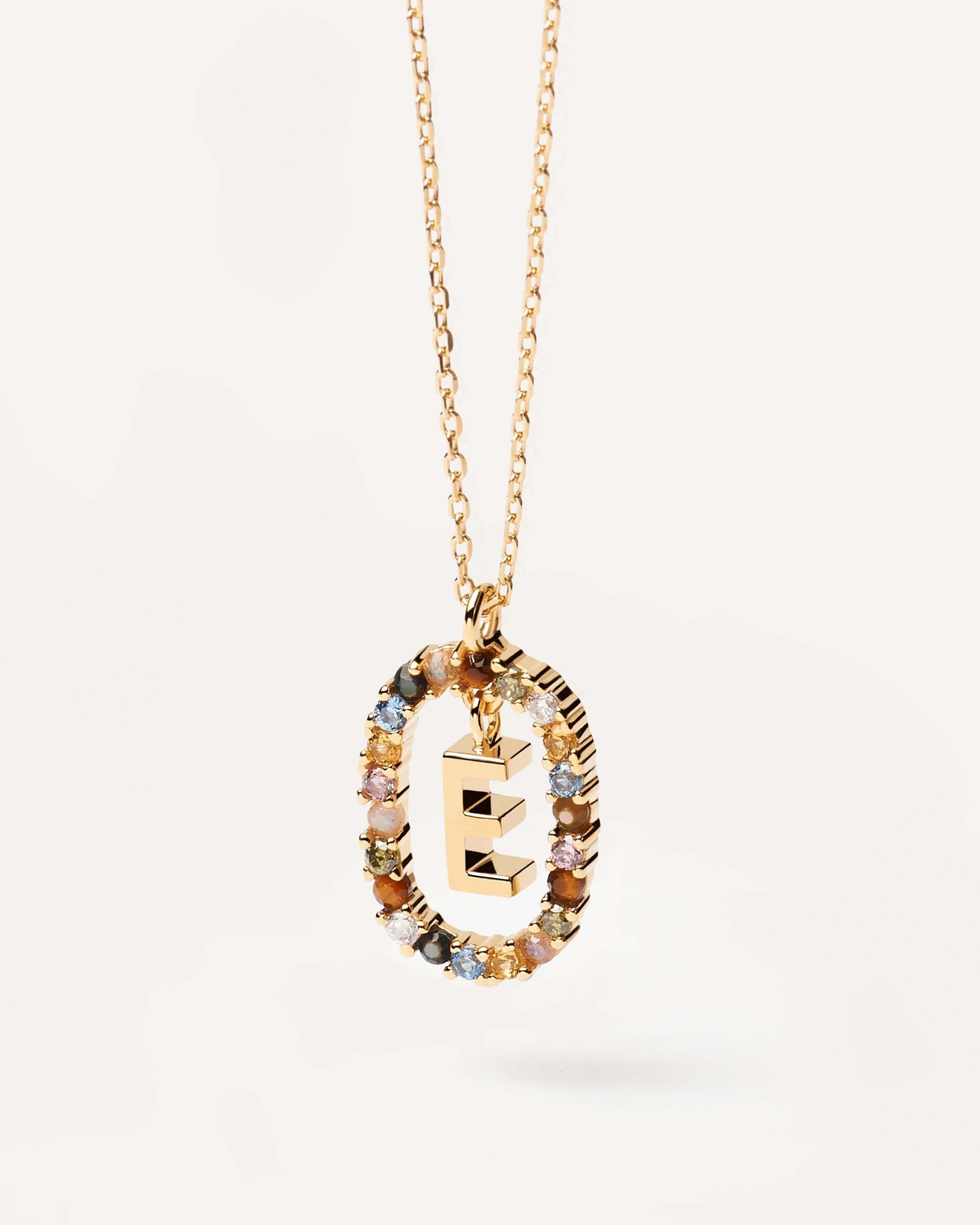 2023 Selection | Letter E necklace. Initial E necklace in gold-plated silver, circled by colorful gemstones. Get the latest arrival from PDPAOLA. Place your order safely and get this Best Seller. Free Shipping.