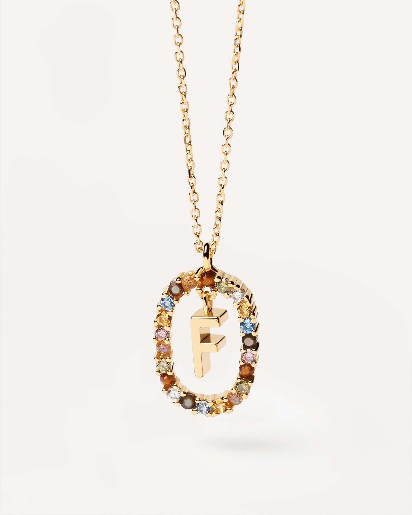 2023 Selection | Letter F necklace. Initial F necklace in gold-plated silver, circled by colorful gemstones. Get the latest arrival from PDPAOLA. Place your order safely and get this Best Seller. Free Shipping.