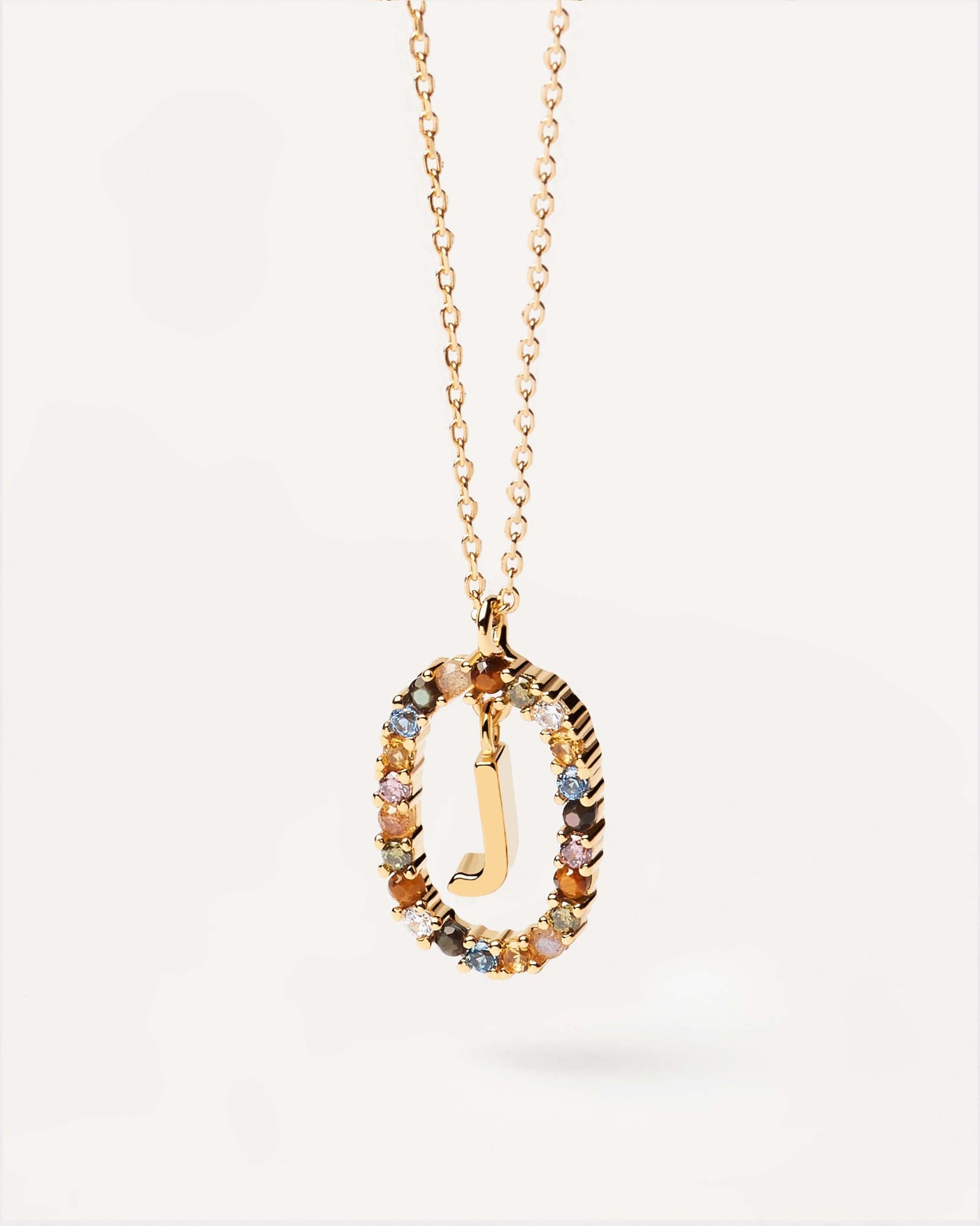 2023 Selection | Letter J necklace. Initial J necklace in gold-plated silver, circled by colorful gemstones. Get the latest arrival from PDPAOLA. Place your order safely and get this Best Seller. Free Shipping.