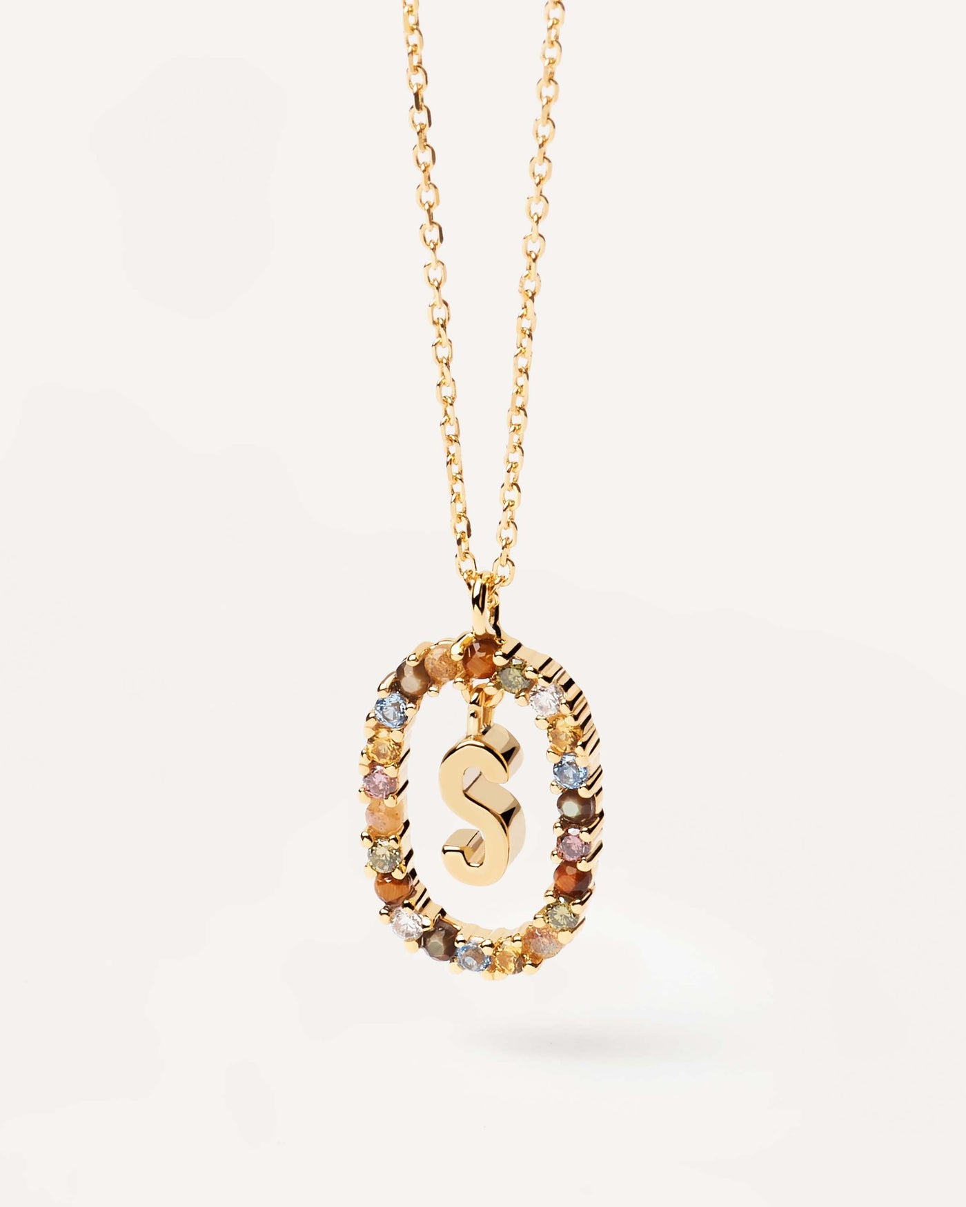 2023 Selection | Letter S necklace. Initial S necklace in gold-plated silver, circled by colorful gemstones. Get the latest arrival from PDPAOLA. Place your order safely and get this Best Seller. Free Shipping.