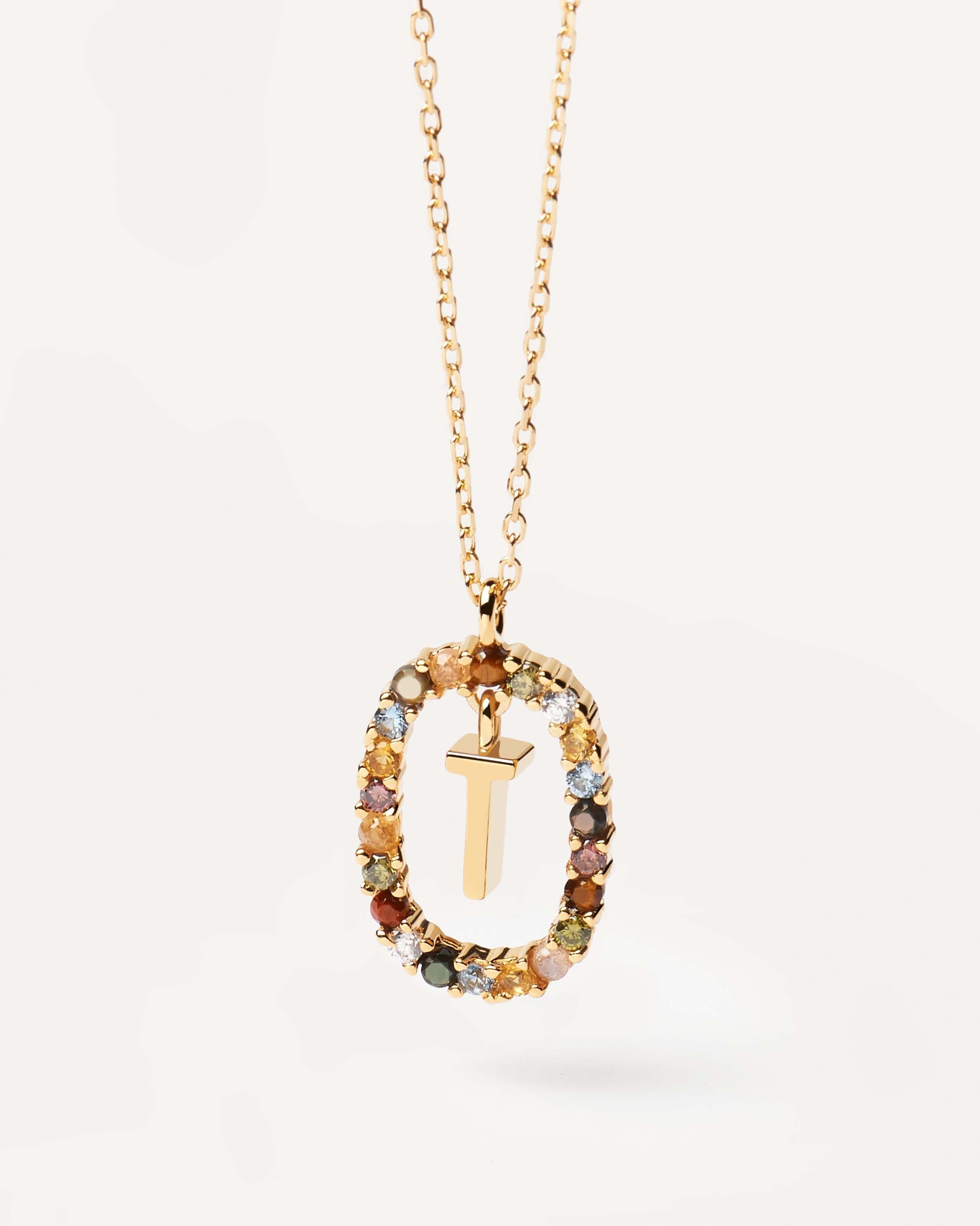 Initial T necklace in gold plated silver circled by colorful gemst. Letter T Necklace PDPAOLA