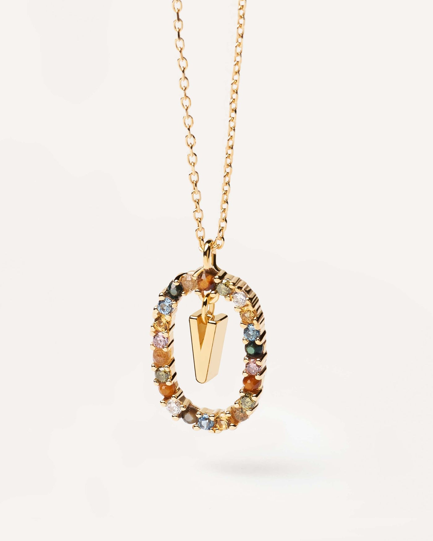 2023 Selection | Letter V necklace. Initial V necklace in gold-plated silver, circled by colorful gemstones. Get the latest arrival from PDPAOLA. Place your order safely and get this Best Seller. Free Shipping.