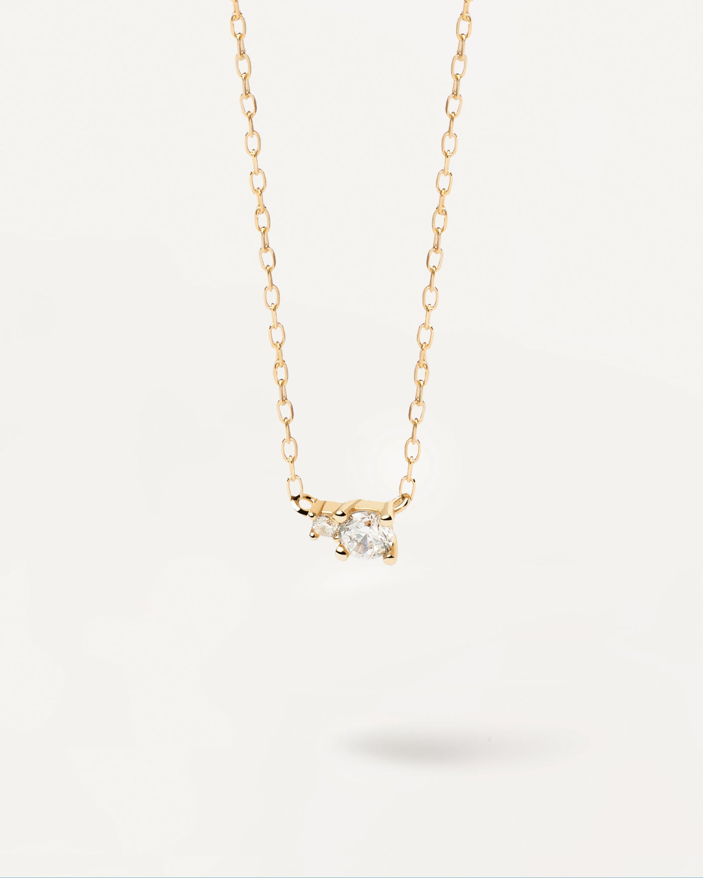 2024 Selection | Diamonds and Gold Duo Necklace. 18K yellow gold necklace with two round diamonds of different sizes, equaling 0.11 carats. Get the latest arrival from PDPAOLA. Place your order safely and get this Best Seller. Free Shipping.