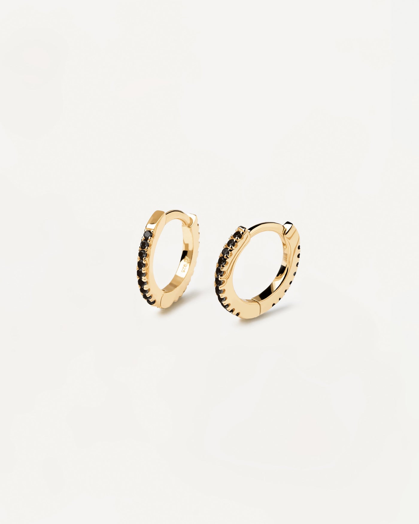 2023 Selection | Black Mini Hoops. Hoop latch-back earrings in 18k gold plated silver set with black zirconia. Get the latest arrival from PDPAOLA. Place your order safely and get this Best Seller. Free Shipping.