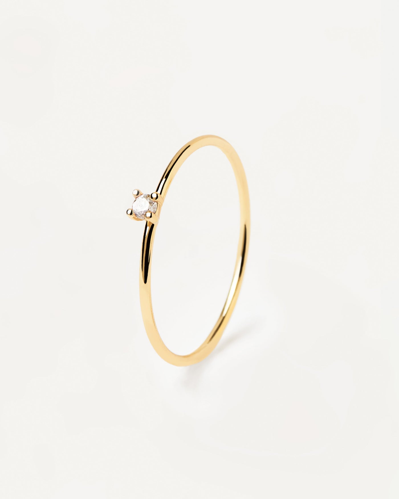 2023 Selection | White Solitary Ring. 18k gold plated silver ring with a single round cut white zirconia. Get the latest arrival from PDPAOLA. Place your order safely and get this Best Seller. Free Shipping.