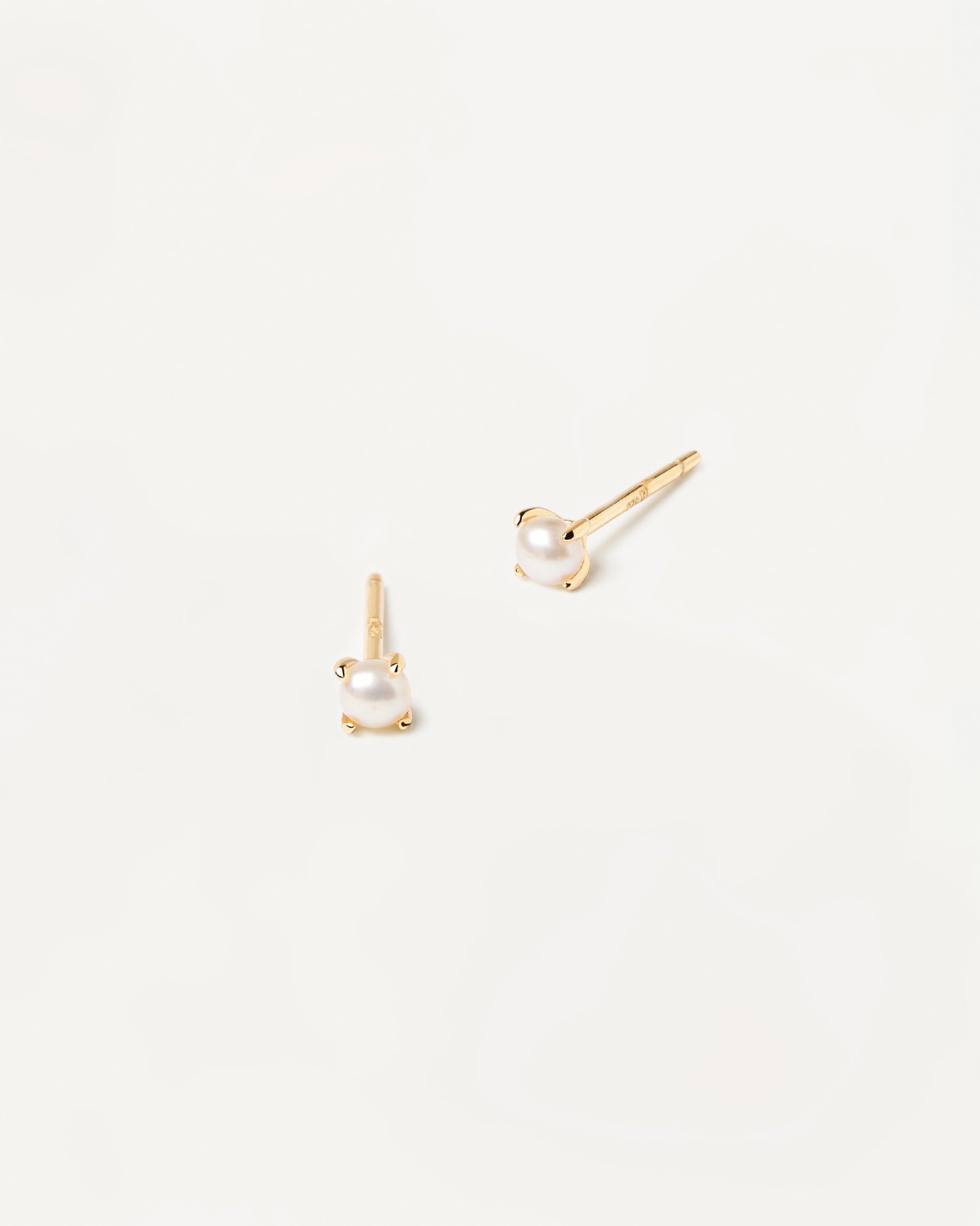 2023 Selection | Solitary Mini Pearl Earrings. Pair of 18k gold plated single small natural pearl studs set on prongs. Get the latest arrival from PDPAOLA. Place your order safely and get this Best Seller. Free Shipping.