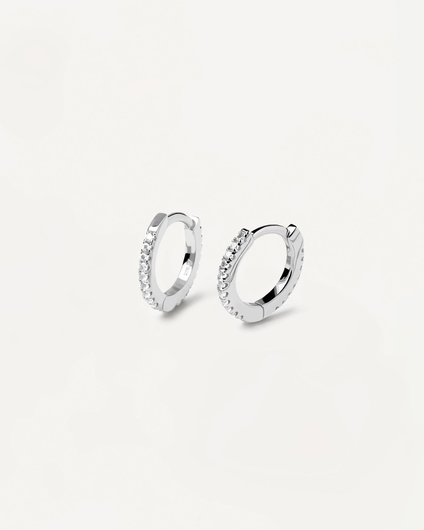 2023 Selection | White Mini Hoops Silver. Hoop latch-back earrings in sterling silver set with white zirconia. Get the latest arrival from PDPAOLA. Place your order safely and get this Best Seller. Free Shipping.