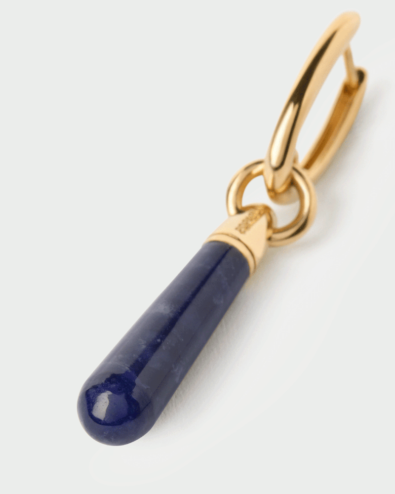 Créole individuelle avec un pendentif de pierre bleu en forme de goutte