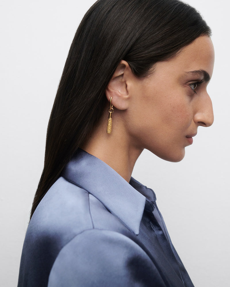Gold-plated single hoop with a molten texture drop pendant
