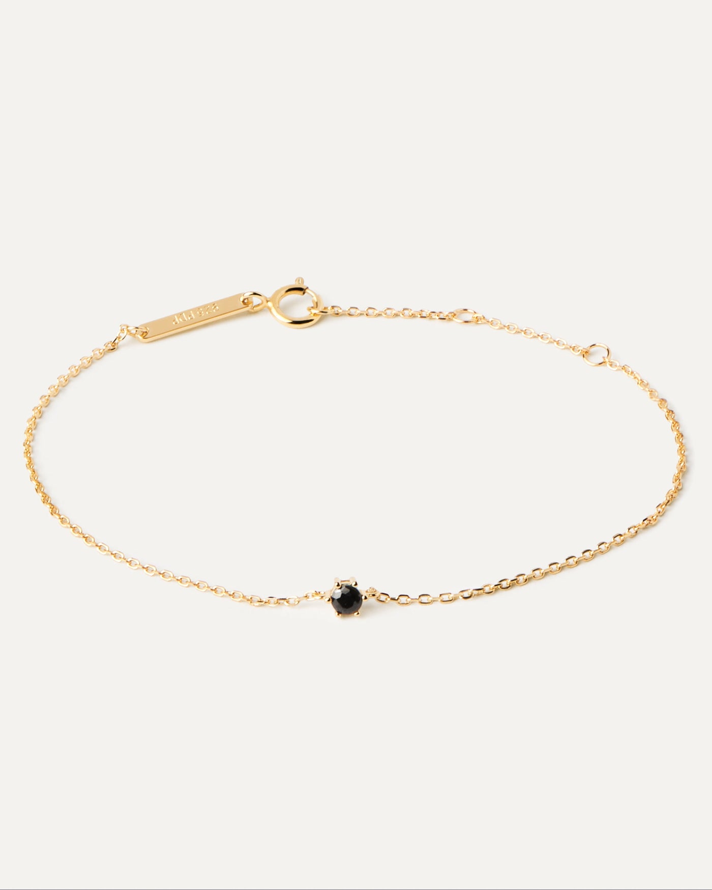 2023 Selection | Black Solitary Bracelet. Thin chain bracelet in 18k gold plated silver and a black zirconia. Get the latest arrival from PDPAOLA. Place your order safely and get this Best Seller. Free Shipping.