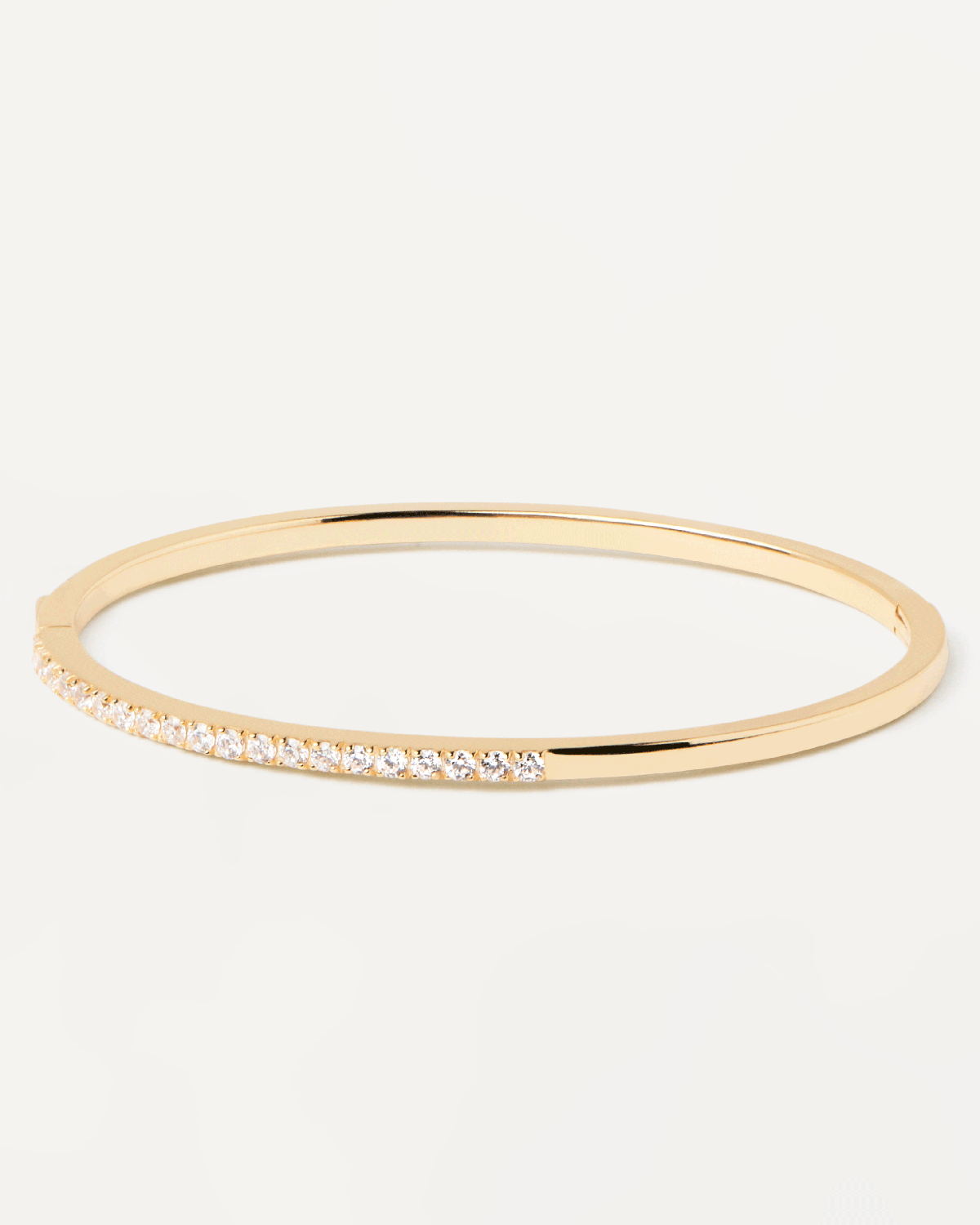 2023 Selection | April Bangle. Gold-plated silver hinged rigid bracelet with 2 bands of white zirconia. Get the latest arrival from PDPAOLA. Place your order safely and get this Best Seller. Free Shipping.