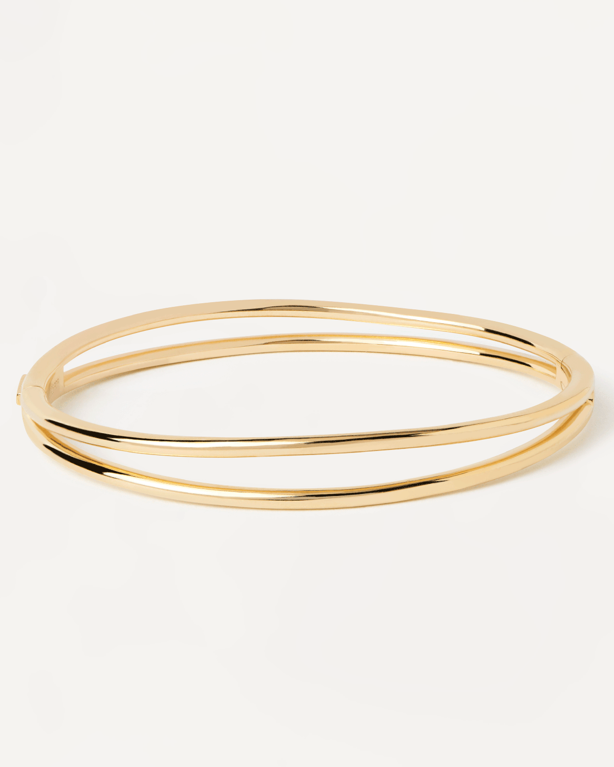 2023 Selection | Twister Bangle. Hinged rigid bracelet with two bands in gold-plated silver. Get the latest arrival from PDPAOLA. Place your order safely and get this Best Seller. Free Shipping.