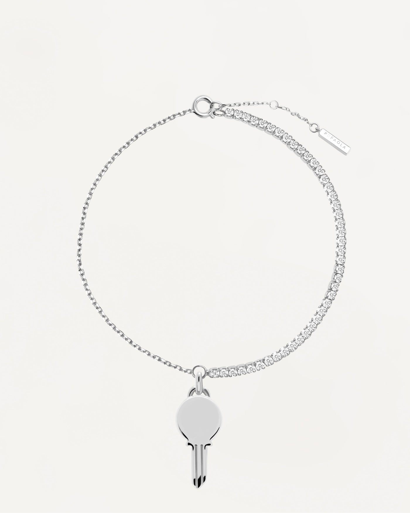 Pulsera Eternum Silver. Pulsera de plata de ley con circonitas blancas y colgante llave personalizable. Consigue las últimas novedades de PDPAOLA. Haz tu pedido de forma segura y obtén este Best Seller.