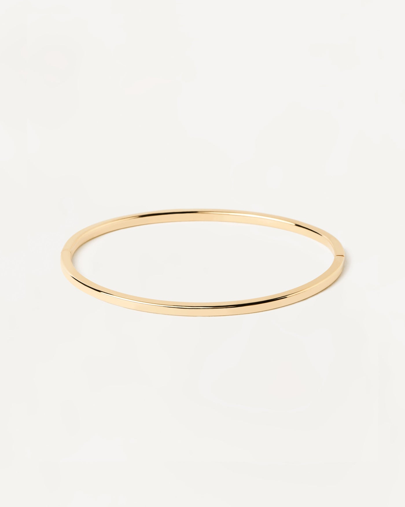 2023 Selection | Gold Core Bangle. 18K solid yellow gold hinged rigid bracelet with basic plain design. Get the latest arrival from PDPAOLA. Place your order safely and get this Best Seller. Free Shipping.